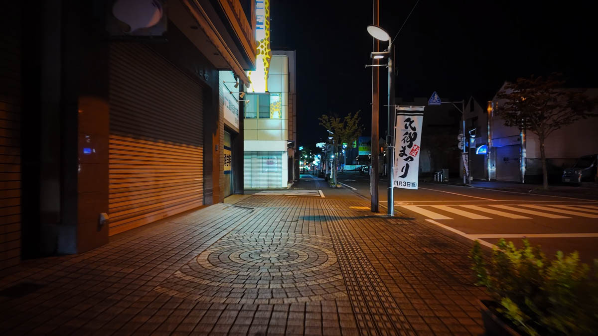 Flags and banners for the Ujisato Festival lining the street near Matsusaka Station