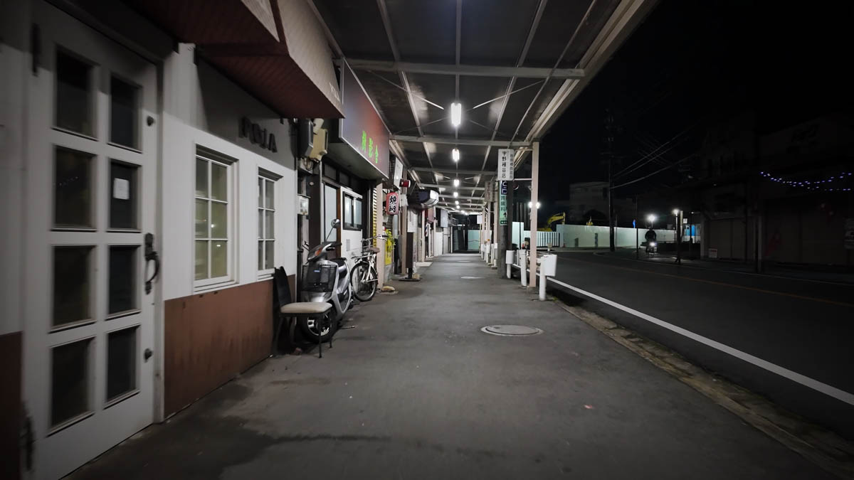 Covered footpath arcade A covered footpath arcade at night, weathered and characterful