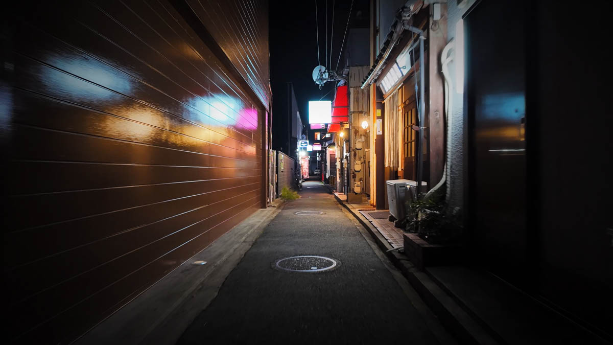 Daimon district laneway A laneway in the Daimon district, bar lights glowing in the dark