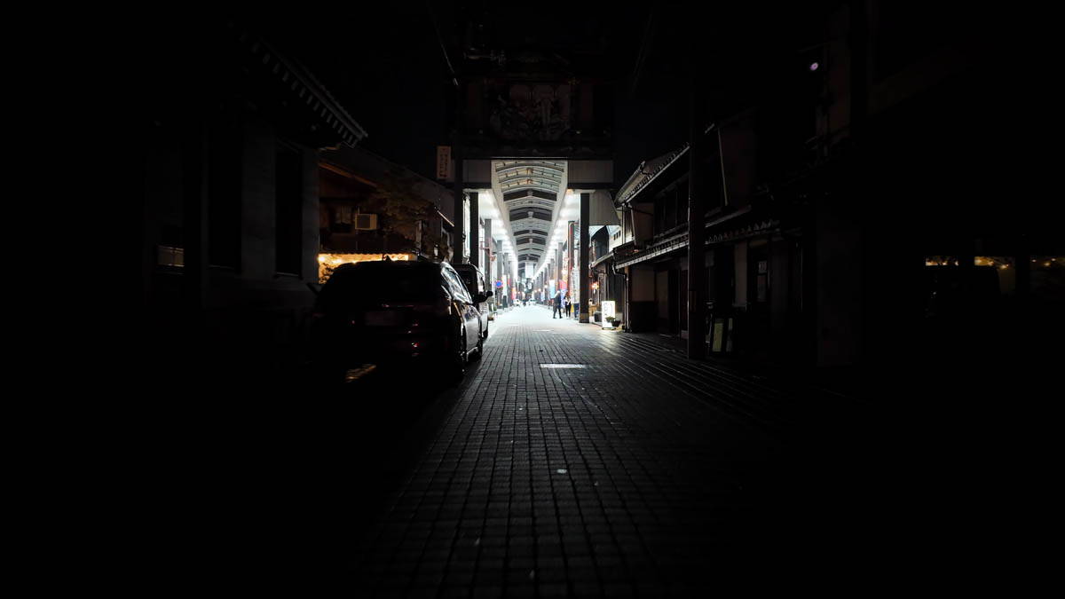 Nagahama Ōtemon-dōri Shopping Arcade glowing brightly against the darker surrounding streets