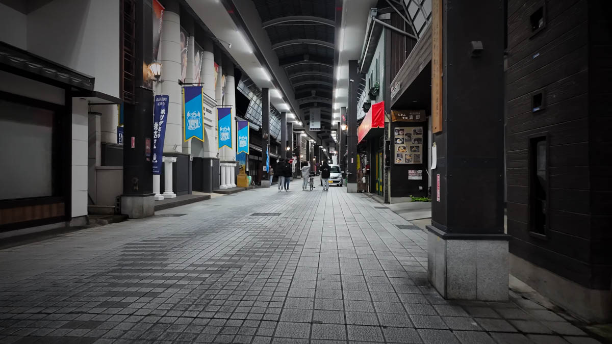 Local residents chatting at a street corner in the evening