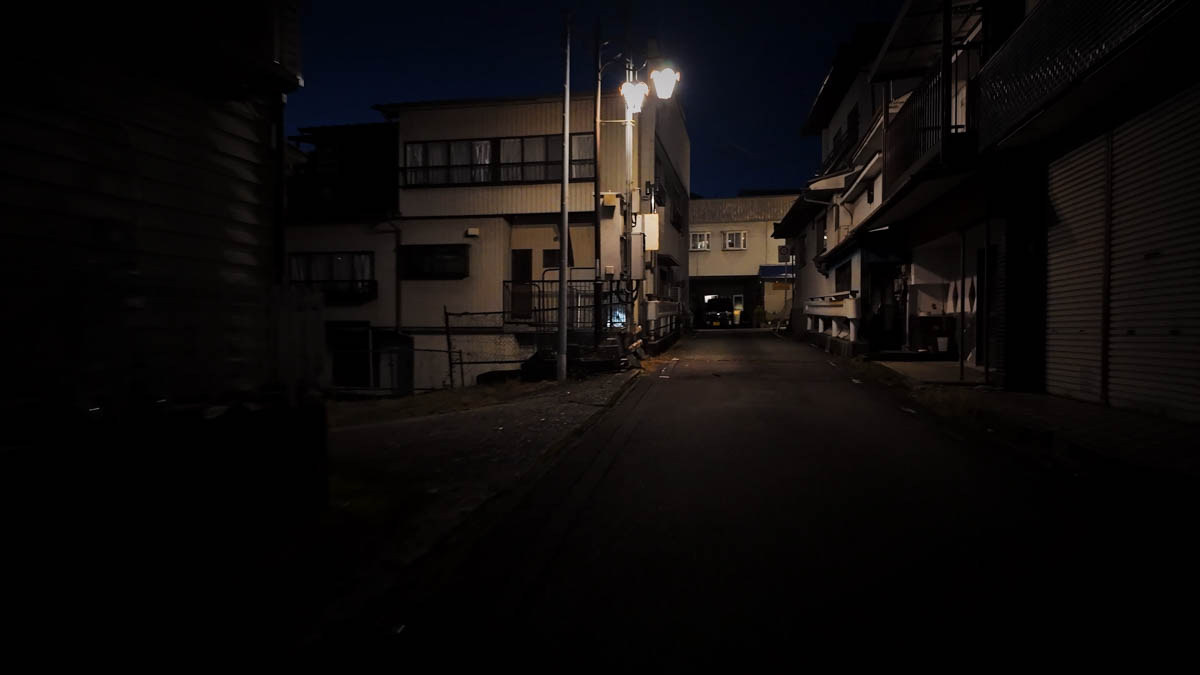 Kinkotsu lane beneath a bridge A narrow kinkotsu lane running beneath a bridge, the characteristic labyrinthine alleyways of Hida-Kanayama
