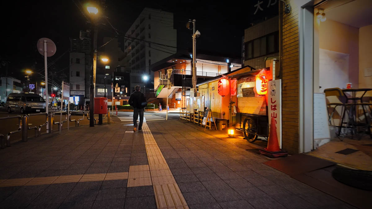 Street food stall near the station A street food stall selling ramen and hormone near the station entrance