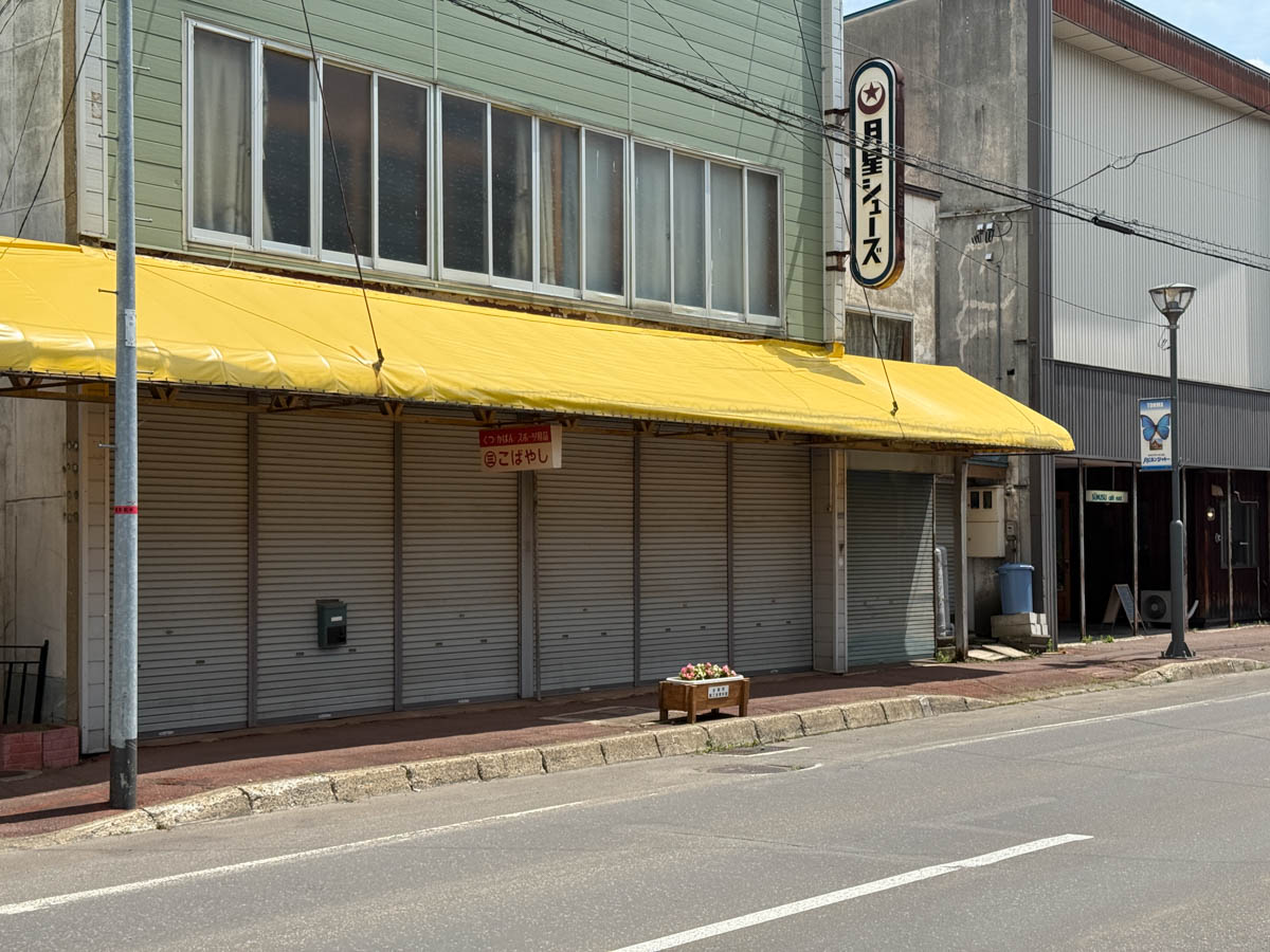 A shuttered shopping street in Toma, Hokkaido — the filming location for the school commute scene in Netflix's First Love