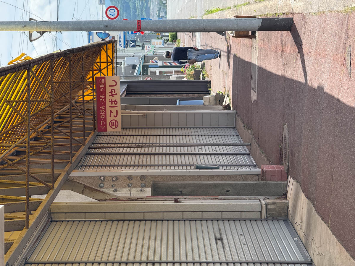 Closed shops lining the shopping street in Toma