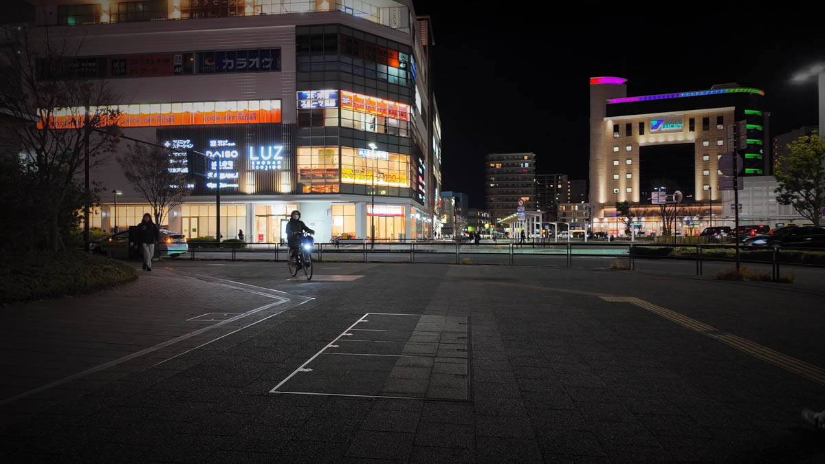 Commercial strip near the station with Daiso and other shops