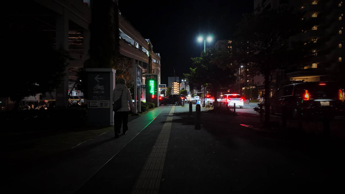 Entrance to a multi-storey car park with cars coming and going