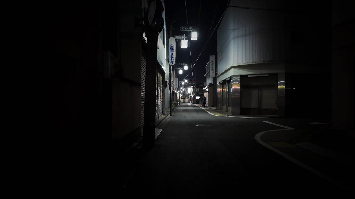 A street lined with lamp posts on the way back to the station, echoing the area's former shopping street