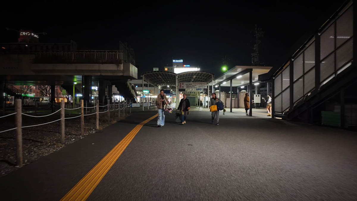 Kuwana Station plaza at night. Few restaurants, quiet and largely empty