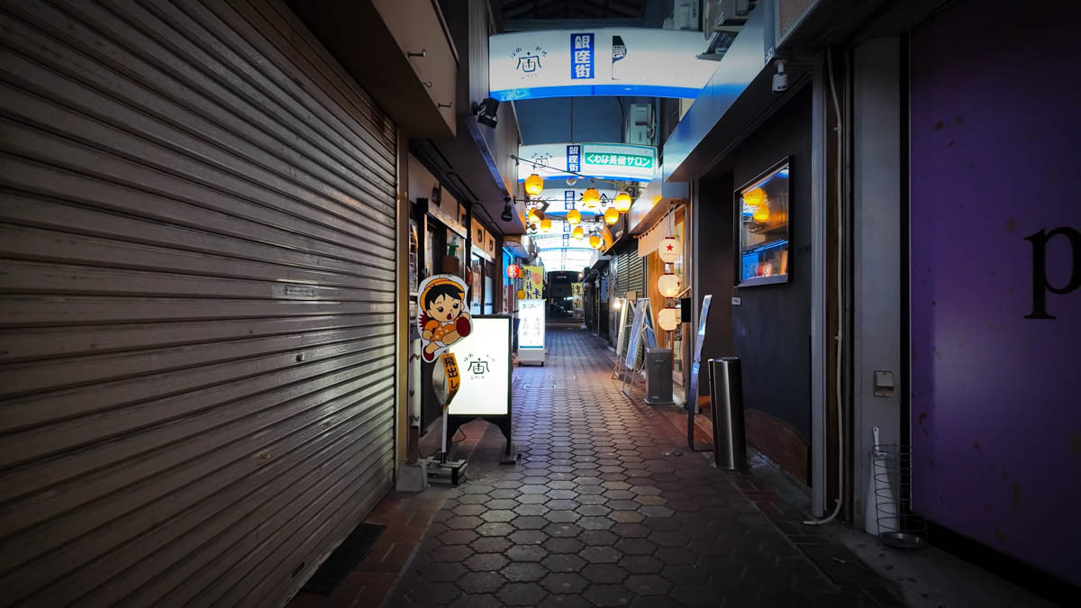 A "watch out for children" road sign featuring a girl, standing by the roadside