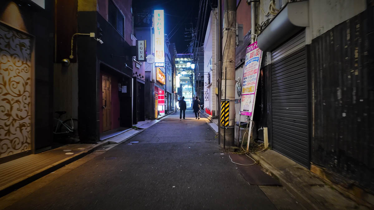 An old cabaret sign, its neon still intact