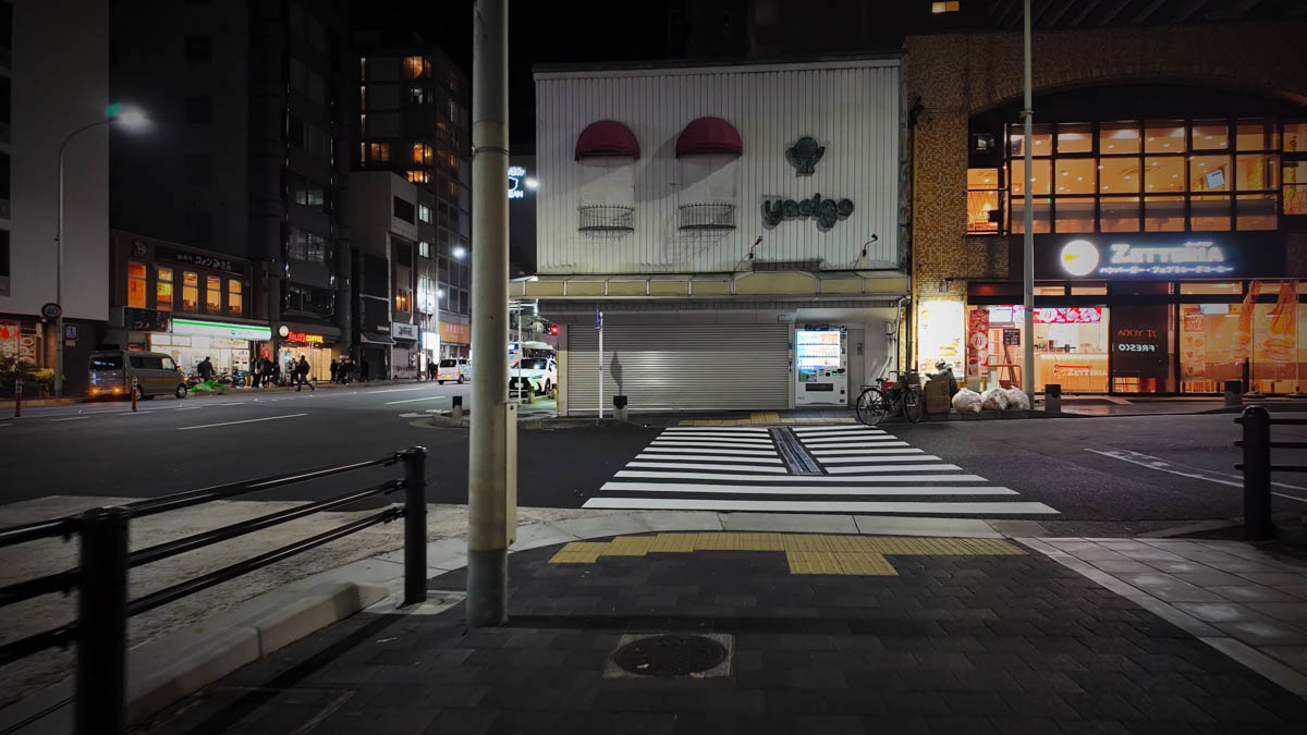 The area near Shijo-Omiya intersection at night, with convenience stores and restaurants lit up