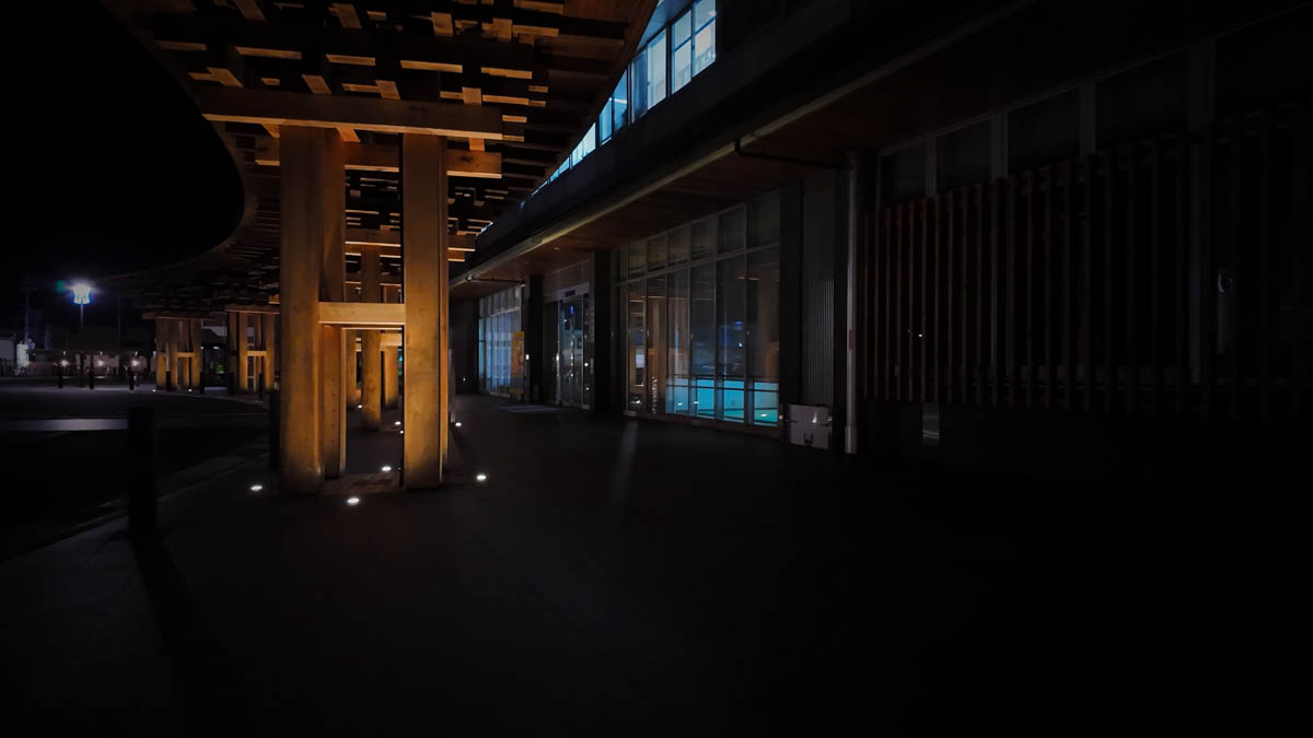 Wooden eaves at the entrance of Maniwa City Hall, lit from below