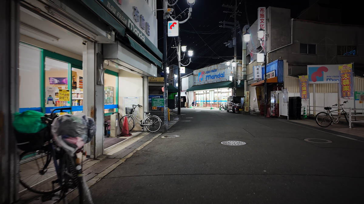 An alley near Fuse Station, with a Mandai supermarket on the left and another Mandai sign farther ahead