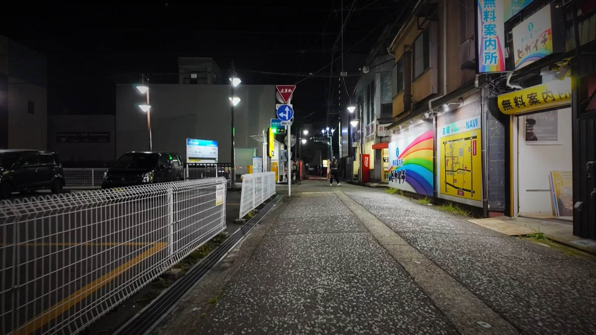 Pikaichi Pikaichi rainbow sign and Takaoka NAVI map board; blue free-information-center sign