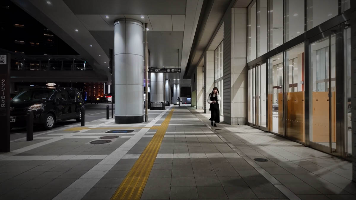 Taxi stand at Takaoka Station Taxi stand and glass-fronted station entrance; yellow tactile paving on the walkway