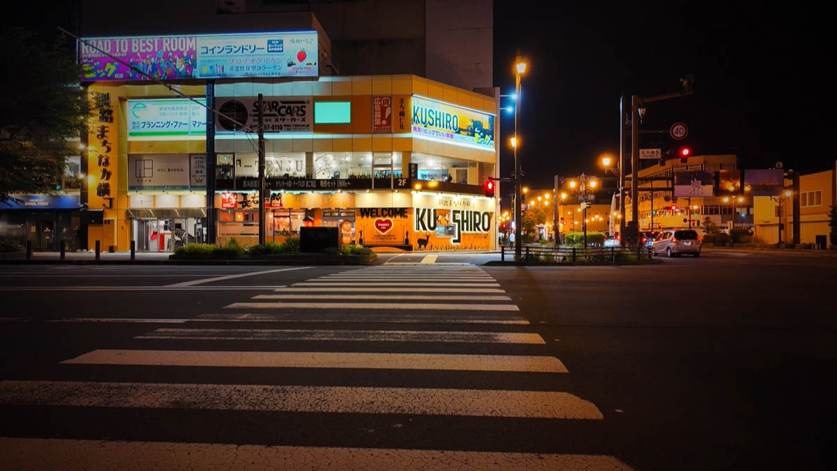Corner building with large KUSHIRO lettering and Choemon signage