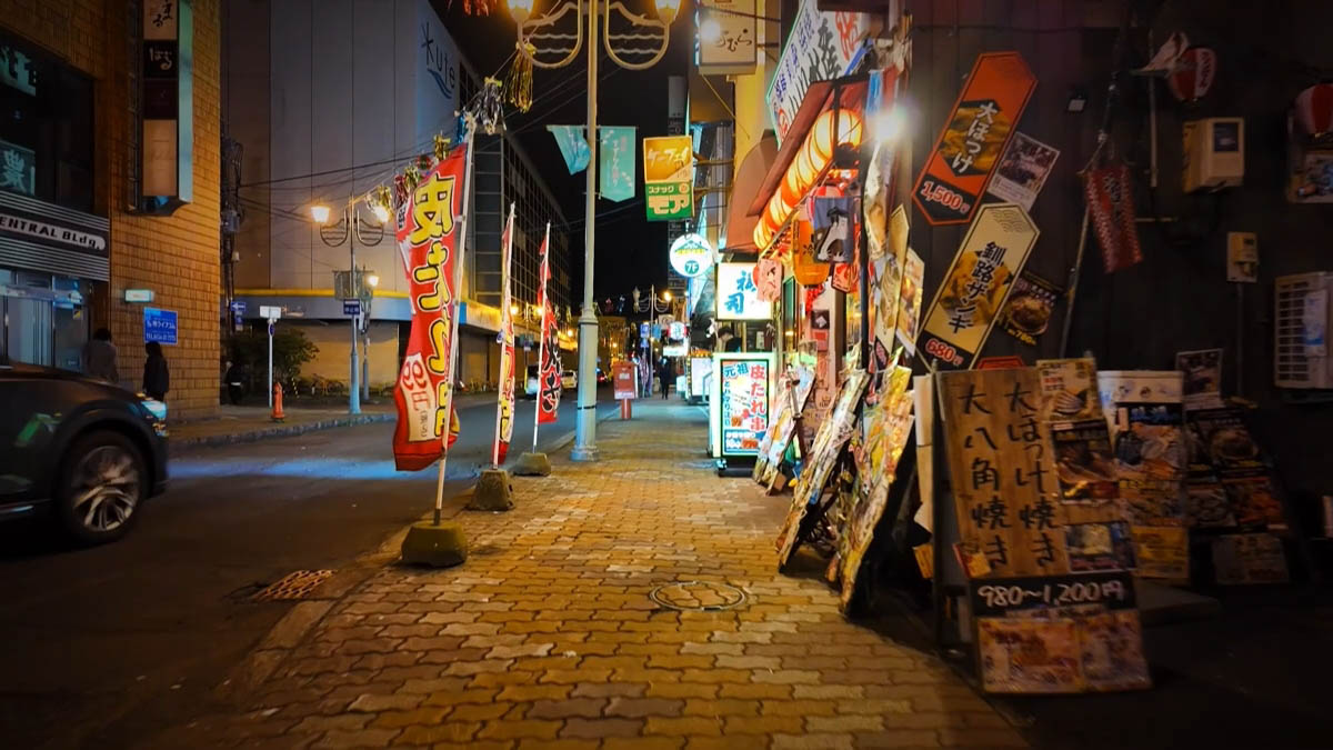 Yellow Kushiro zangi sign and grilled hokke menu boards