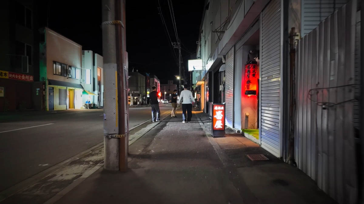 Red chochin and standing sign for Izakaya Banya