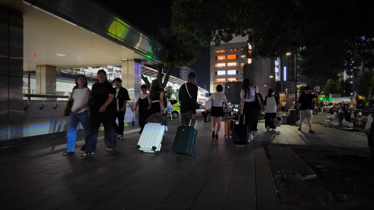 Suitcases at the station Travelers pulling suitcases under the station canopy