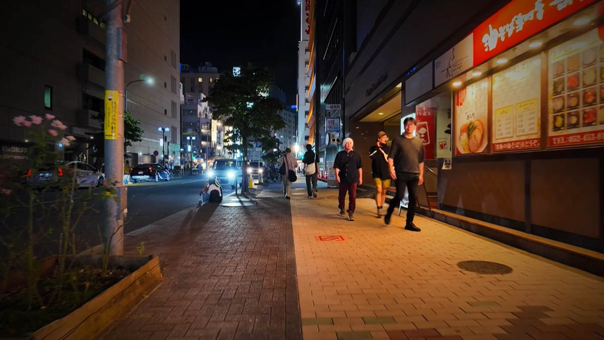 Abura-soba street Abura-soba shopfront and walkers on the sidewalk